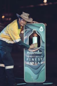Patrick using portable water refilling station